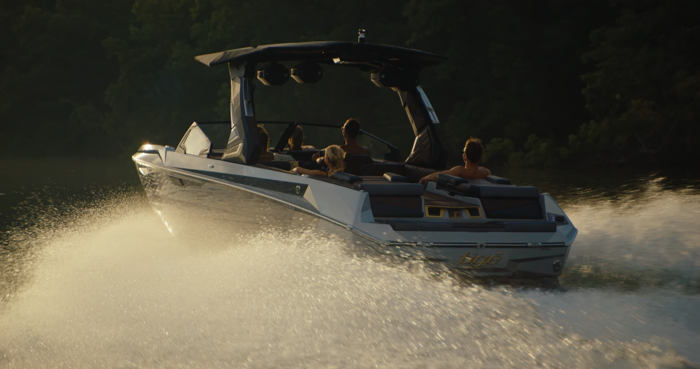 Boat carving a wake across the lake at golden hour