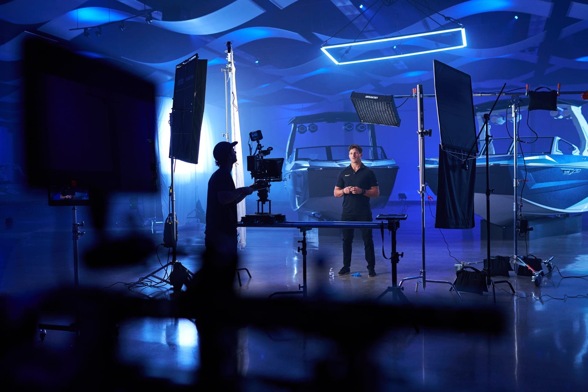 Director of photography shooting a blue-lit production set